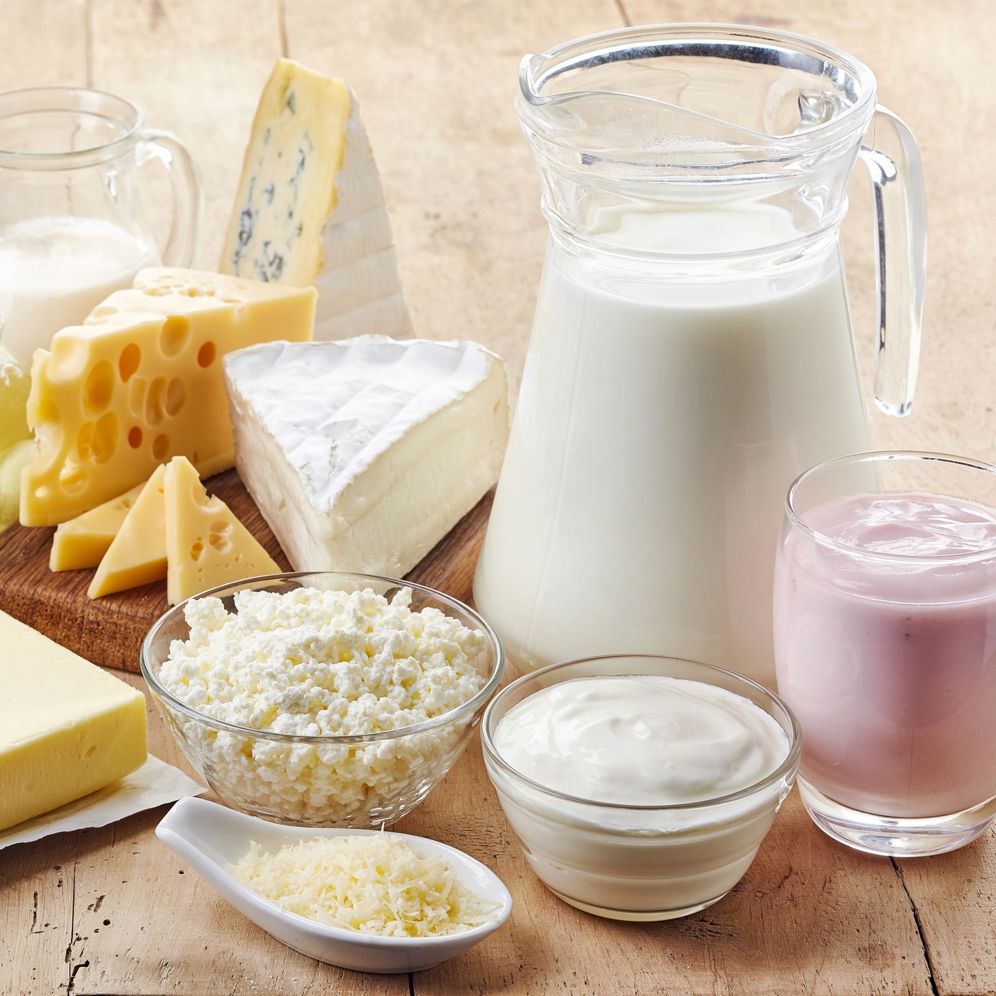 Various fresh dairy products on wooden background